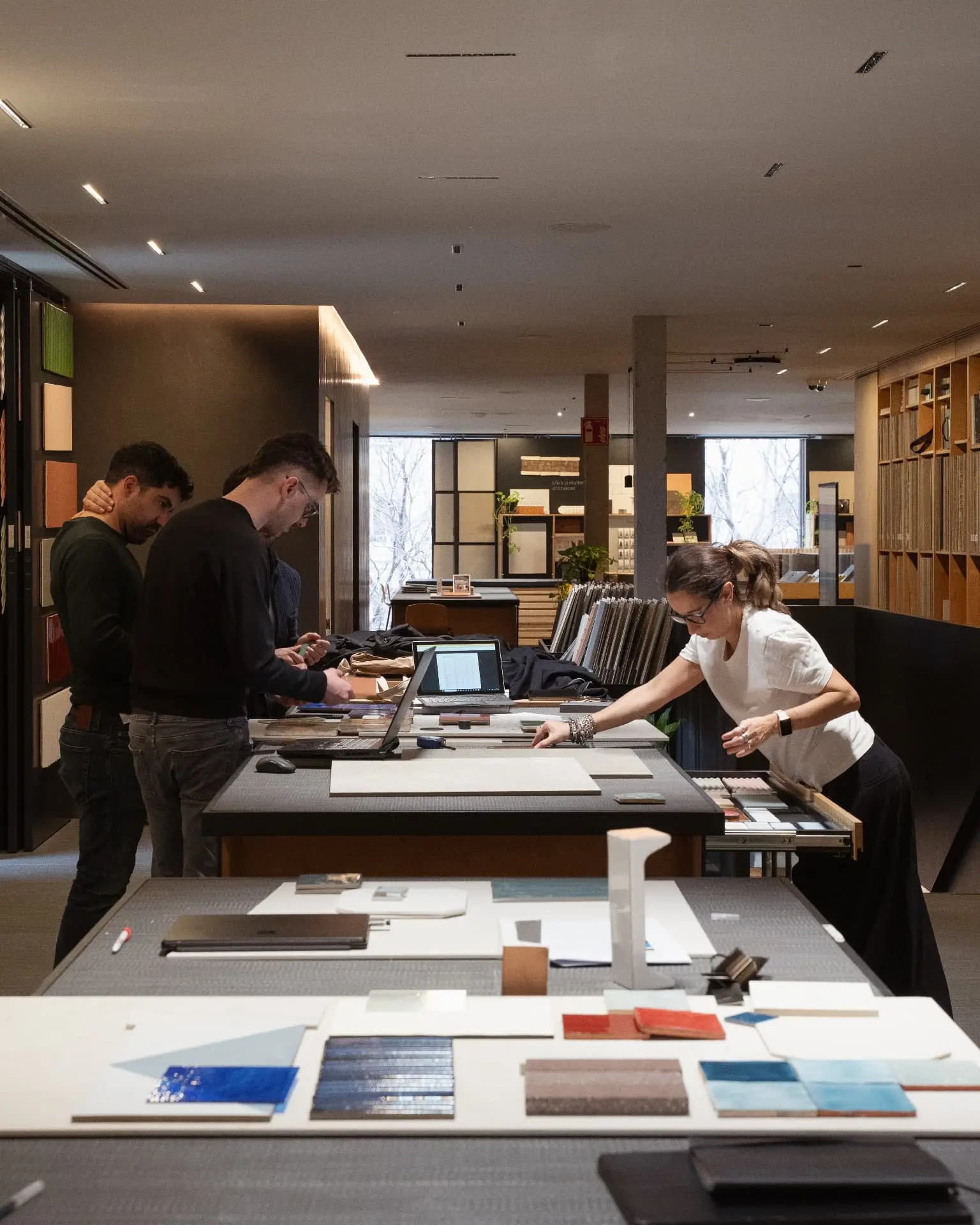 Professionals comparing samples on the material library work tables