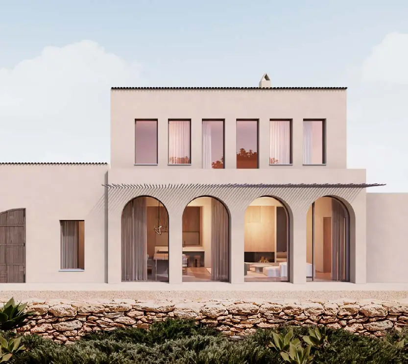 Pink façade of the Alella house with arches on the ground floor above a dry-stone wall