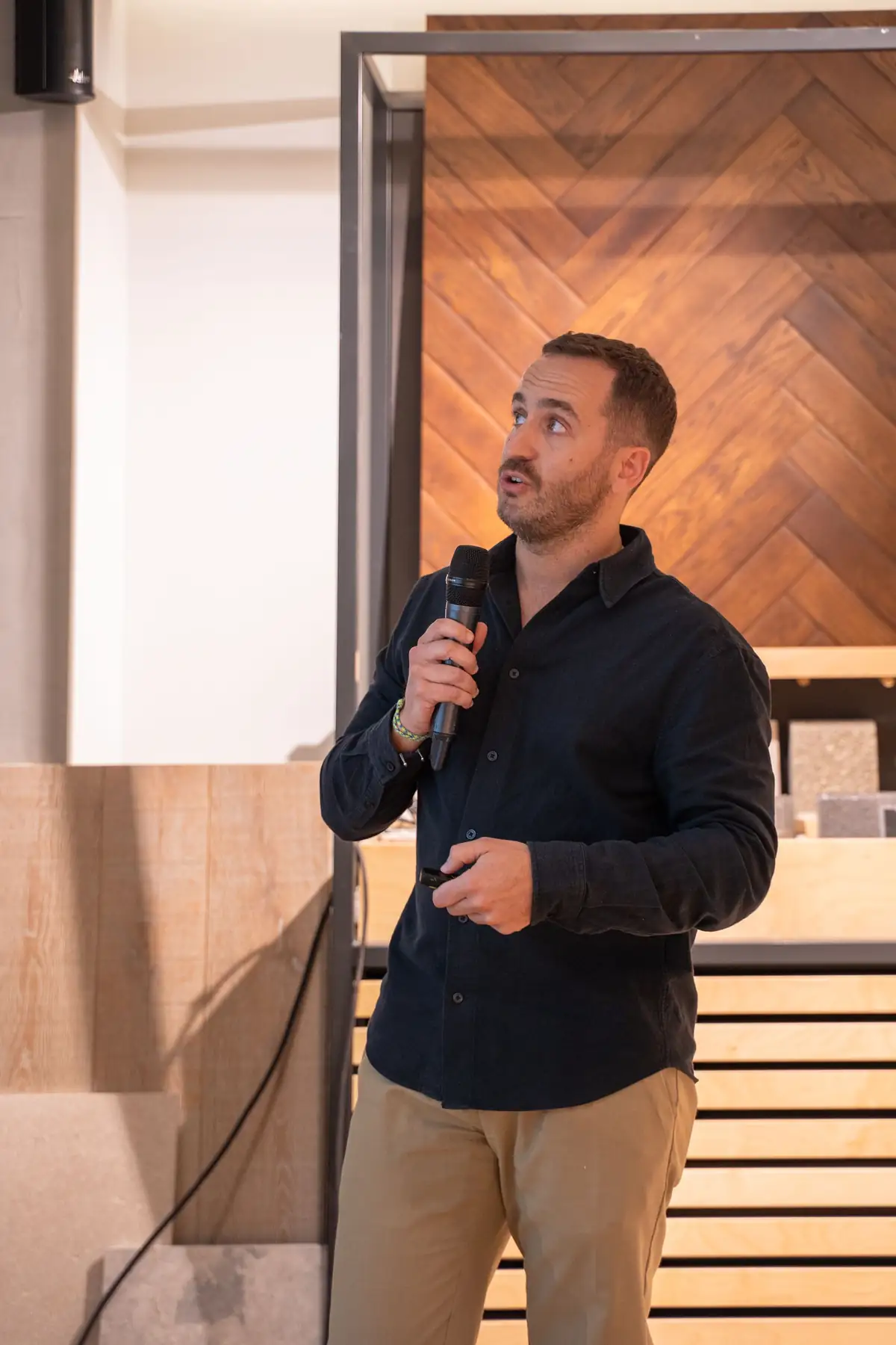 Speaker holding a microphone during his talk at Matter Madrid