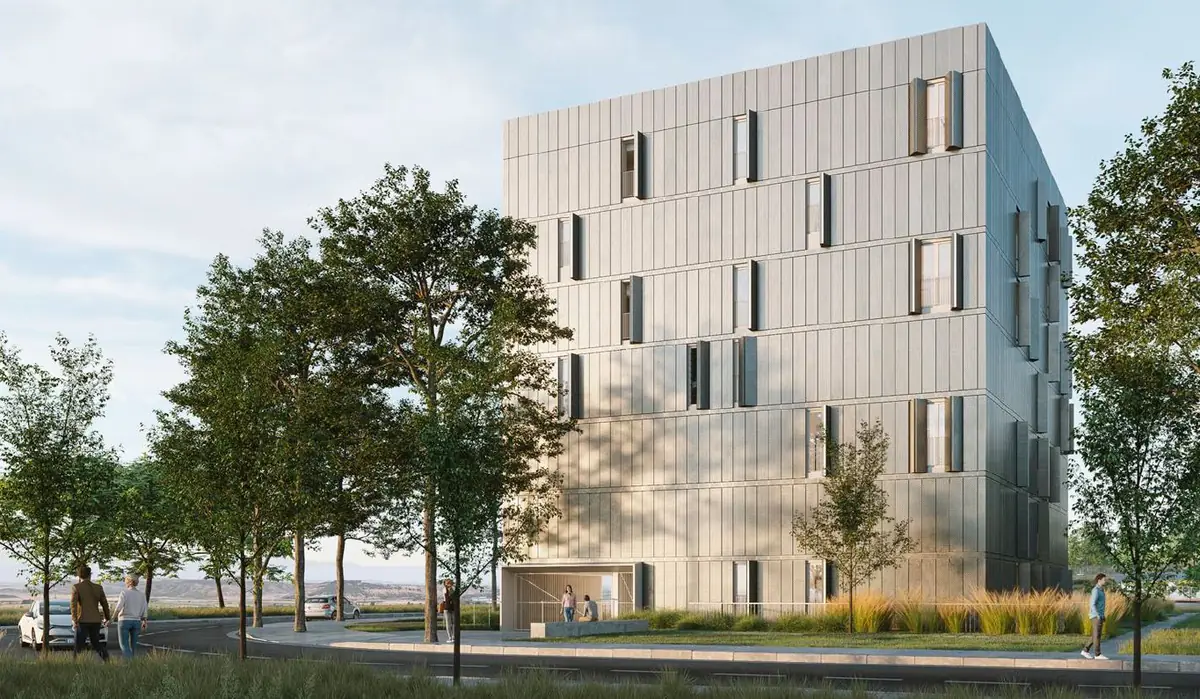 Render of a five-storey housing block with a pale façade among trees