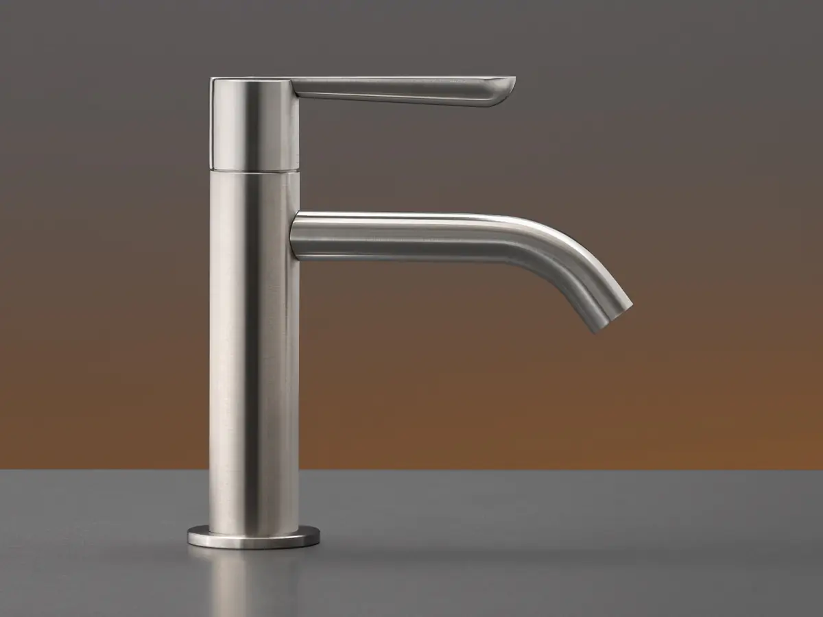 Satin steel single-lever basin tap with a cylindrical body, a flat lever on top and a curved spout