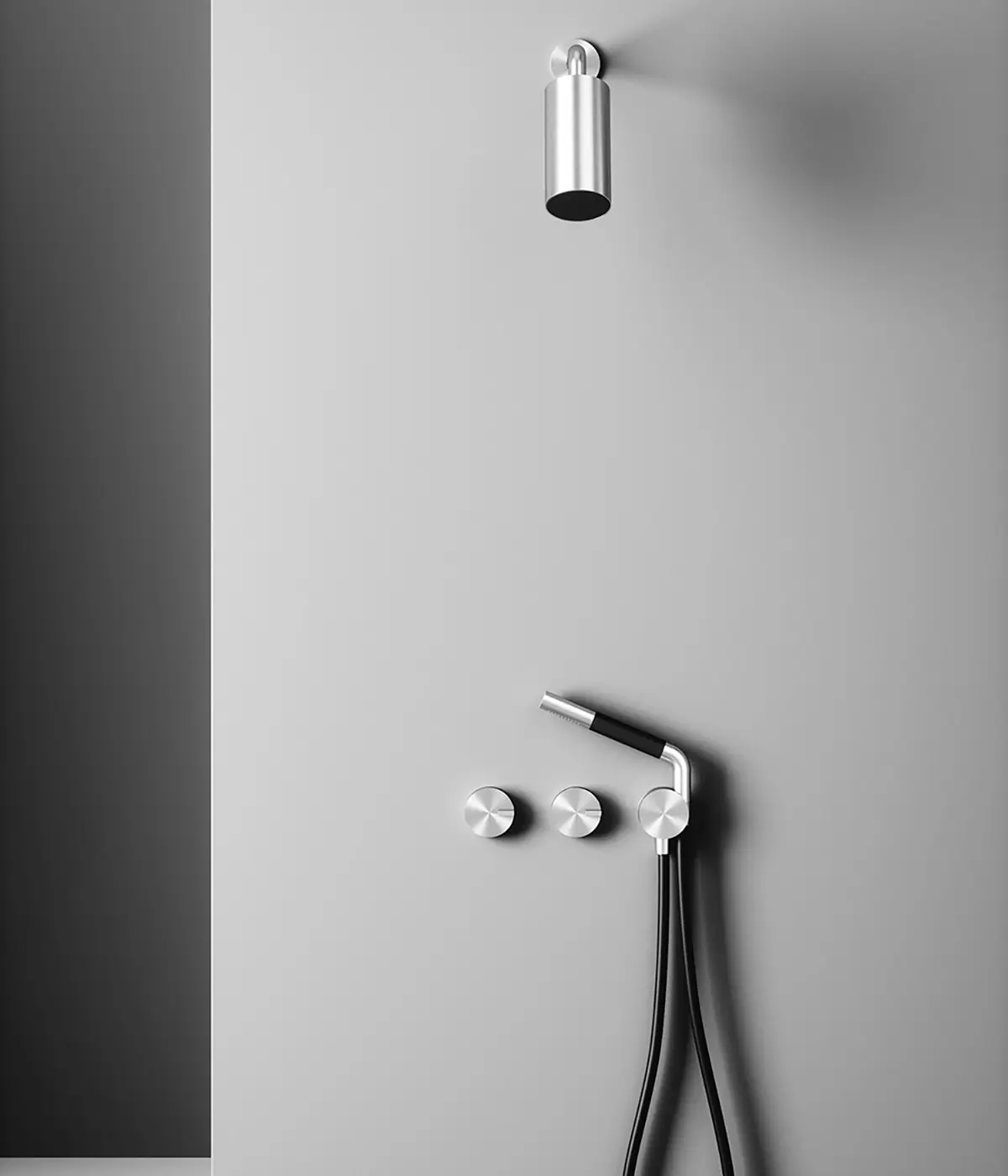 Cylindrical ceiling shower head and, on the wall, two circular controls and a steel hand shower