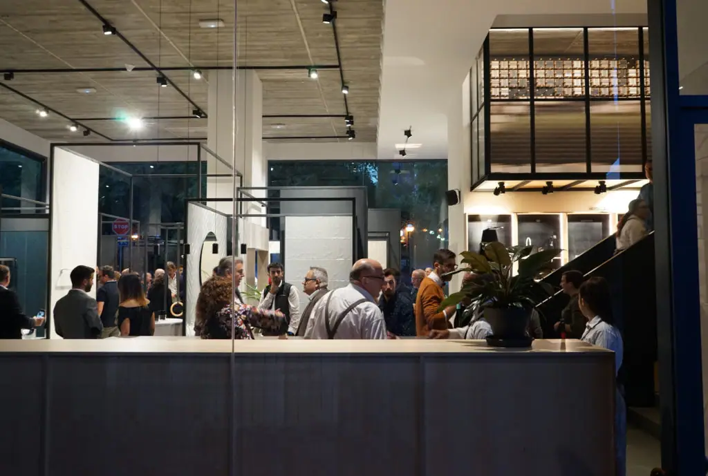 Guests talking among the bathroom settings on the ground floor