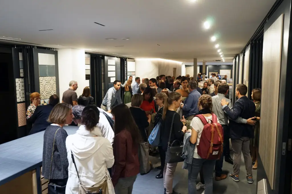 Corridor full of guests between ceramic display panels
