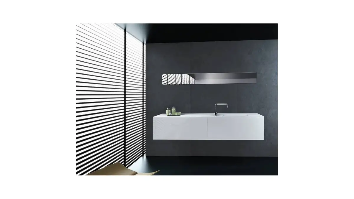 Bathroom with a white wall-hung vanity unit, a chrome tap and a dark wall beside a louvred window.