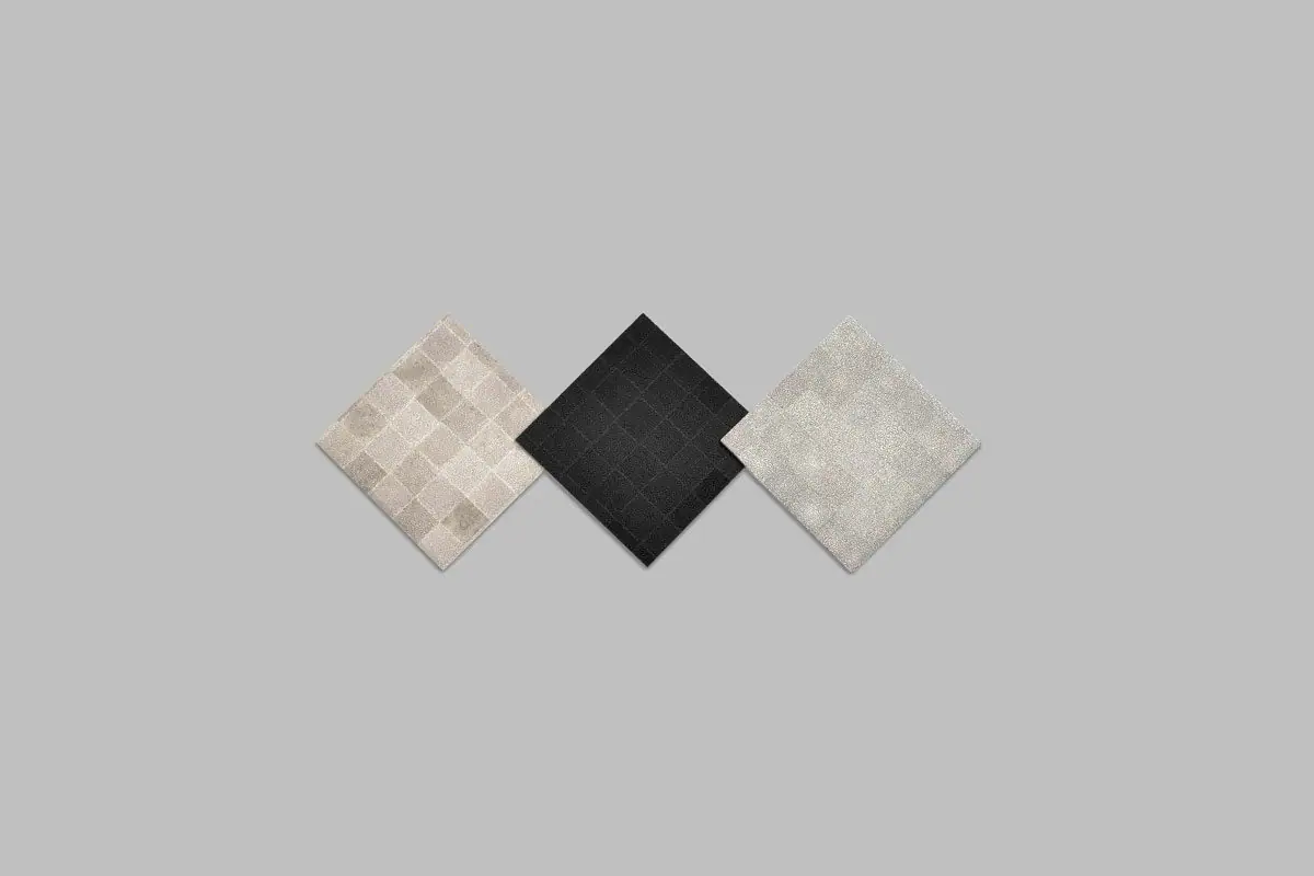 Tres muestras cuadradas de karuun® shine en beige, negro y gris claro, con textura de puntos.