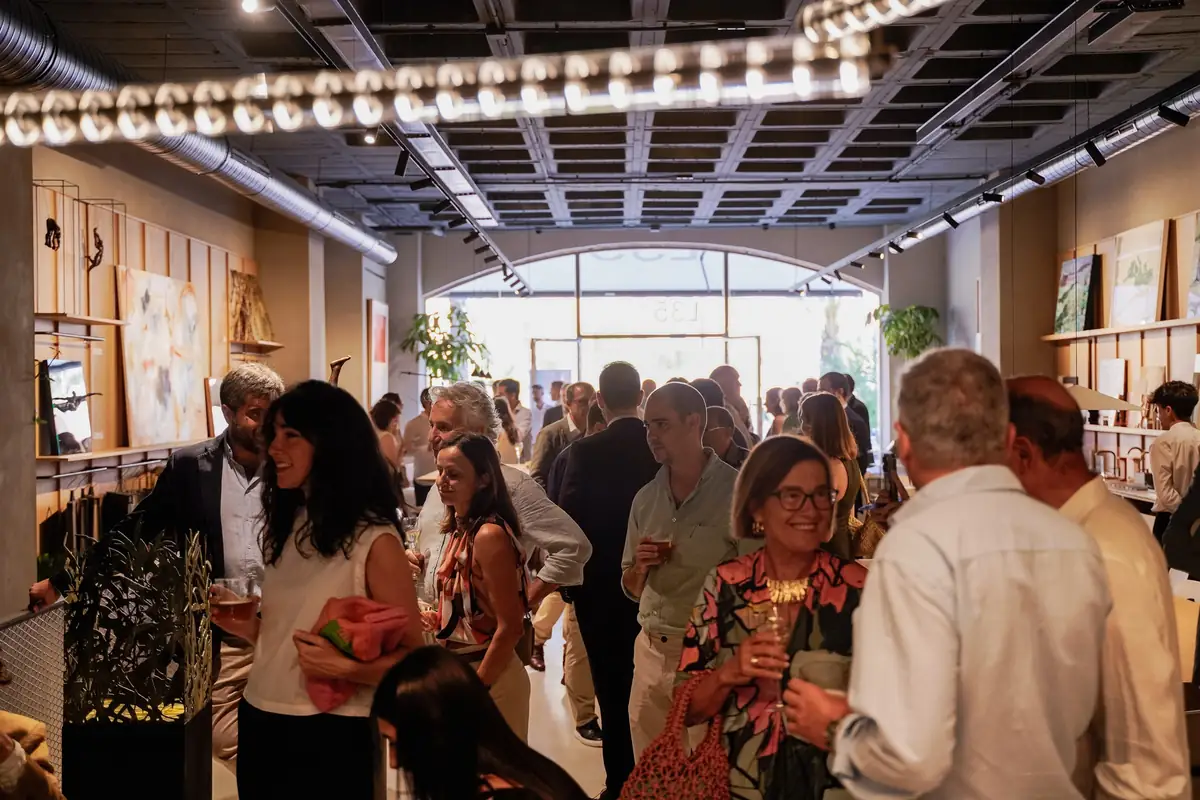 Guests talking inside the space during the opening