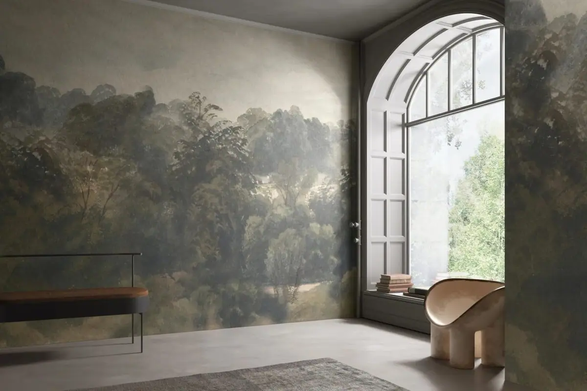 Living-room wall covered with a forest landscape in shades of green, next to a large arched window