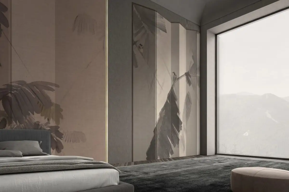 Bedroom with wallcovering panels showing large tropical leaves in pinkish and grey tones