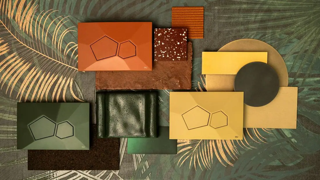 Tres pulsadores VORONOI en terracota, verde y amarillo entre muestras de materiales