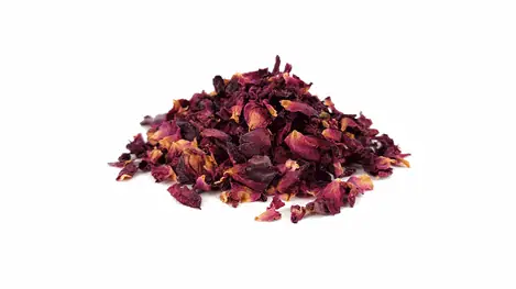 Pile of dried rose petals on a white background