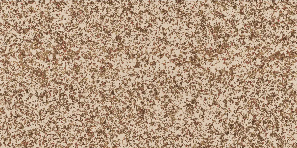 Densely covered surface with leaf fragments in brown, green and reddish tones
