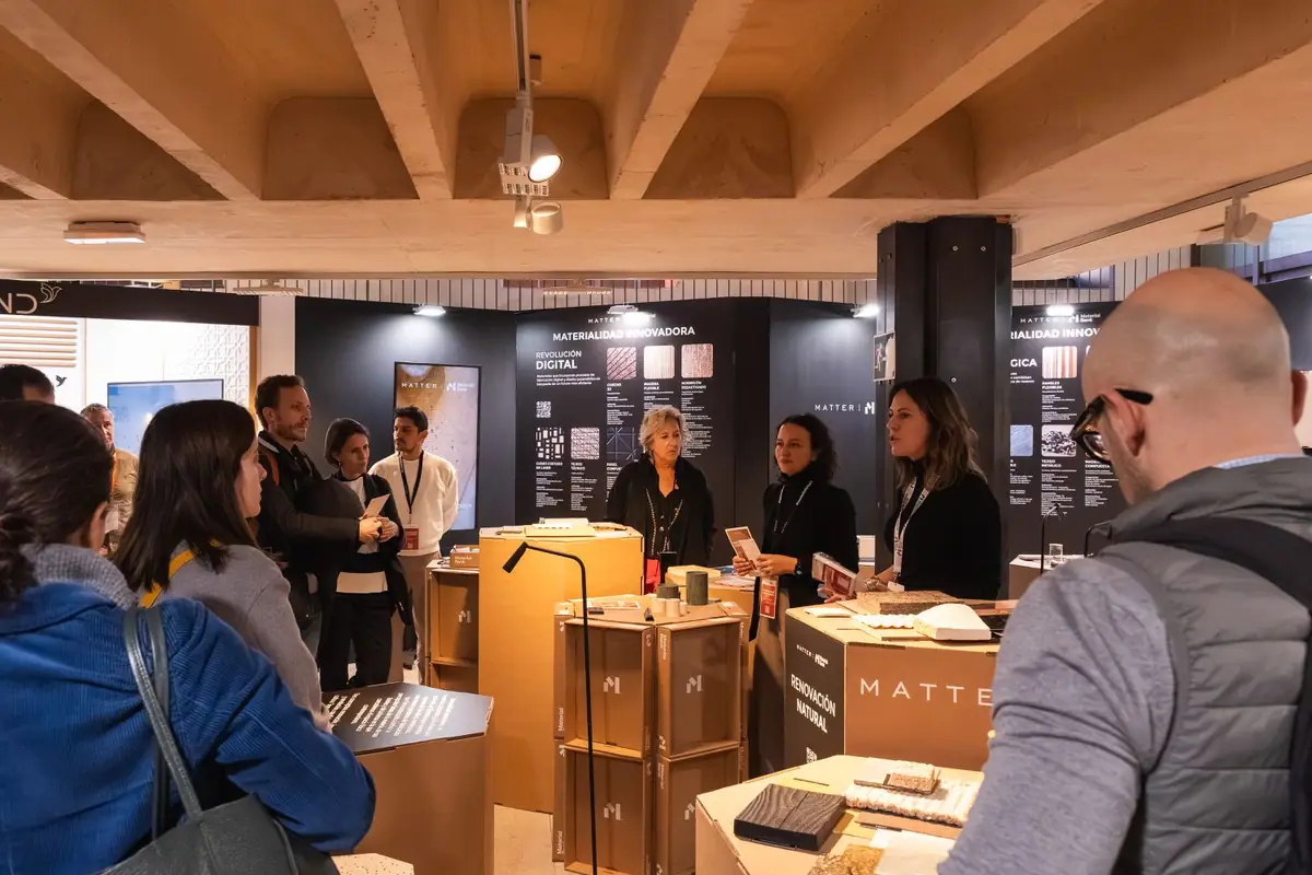 Group of visitors listening to three Matter guides in front of the Digital Revolution panel