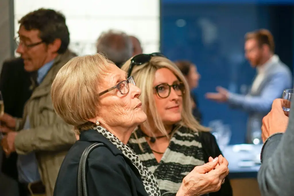 Attendees talking during the aperitif after the tribute