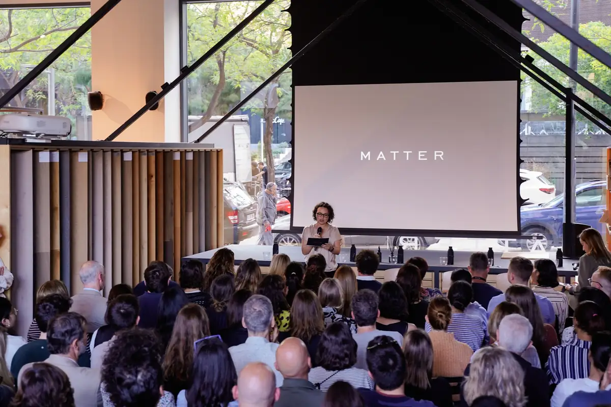 Audience seated at Matter Barcelona in front of a screen with the Matter logo, during the session