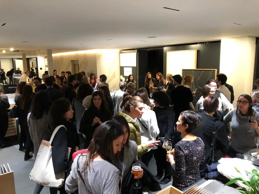 Attendees talking standing in the Matter showroom after the talk