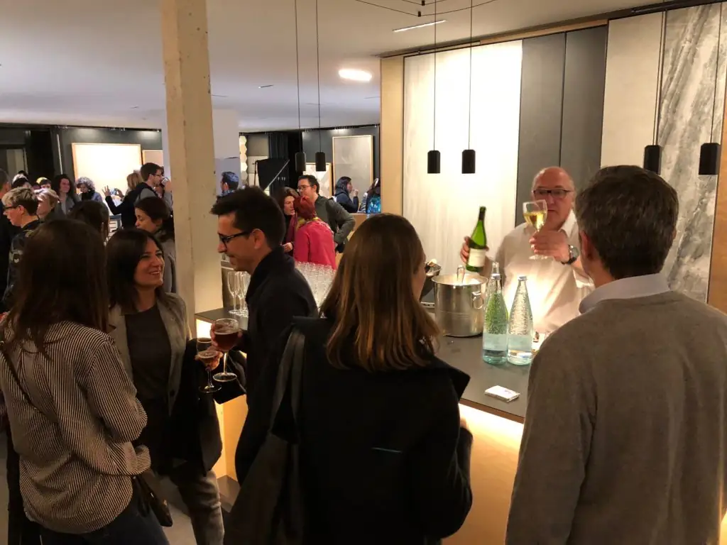 Attendees by the aperitif bar in the Matter showroom
