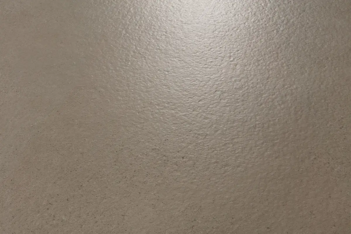 Backlit detail of the rough surface of a cement-effect porcelain tile