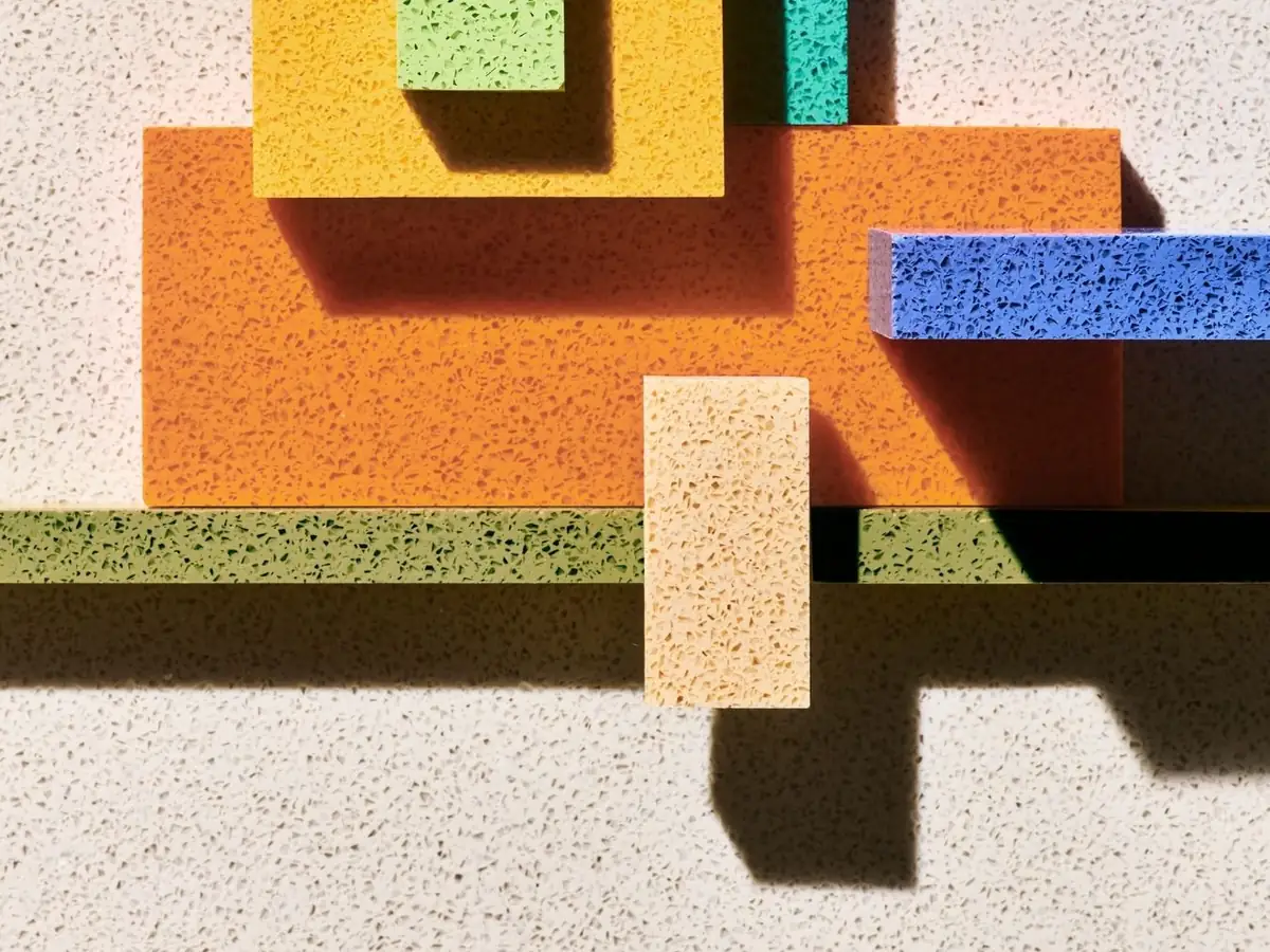 Overlapping Durat sheets in orange, yellow, green and blue with their characteristic speckles