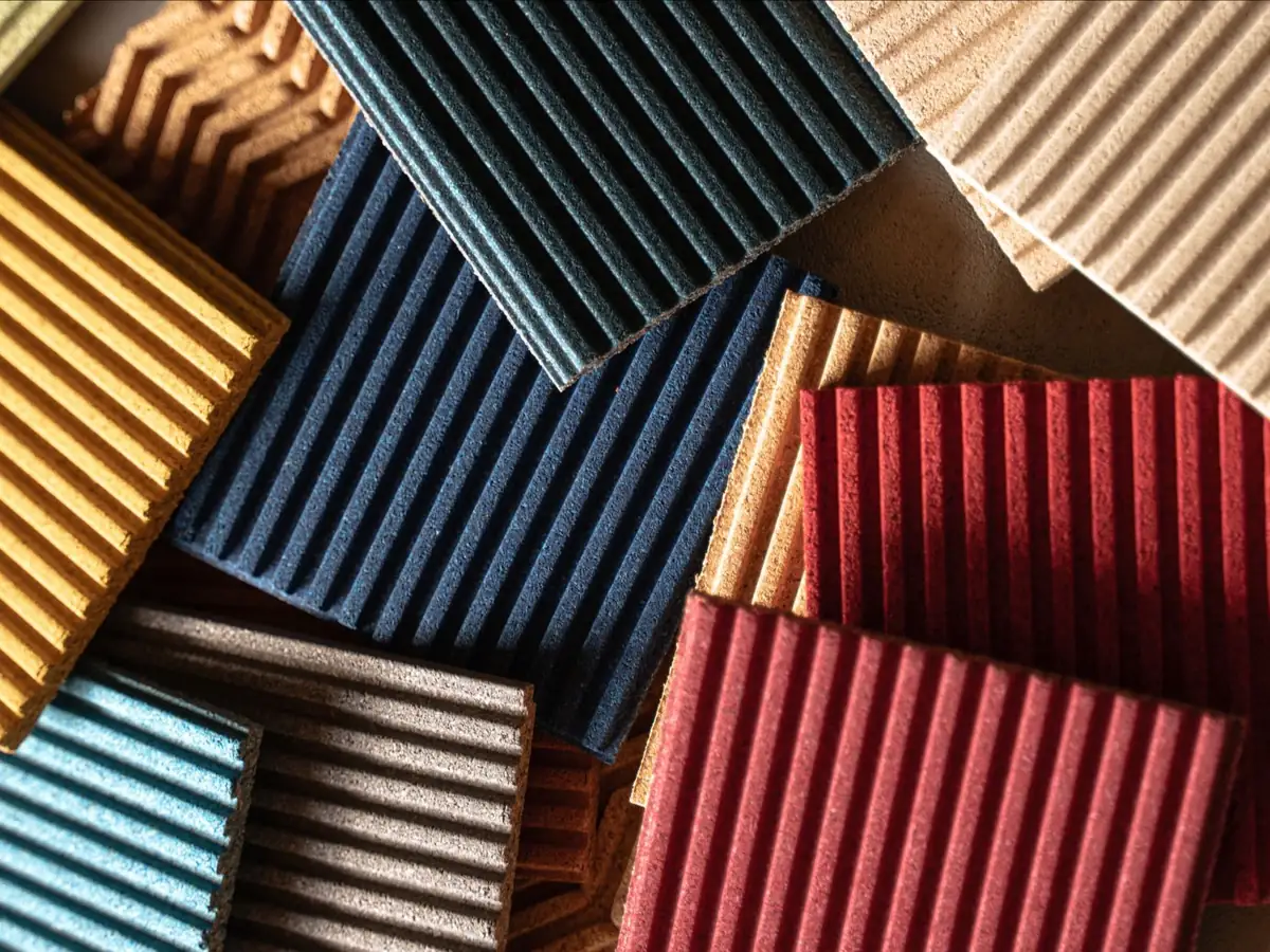 Overlapping fluted cork panels in yellow, blue, red and natural tones