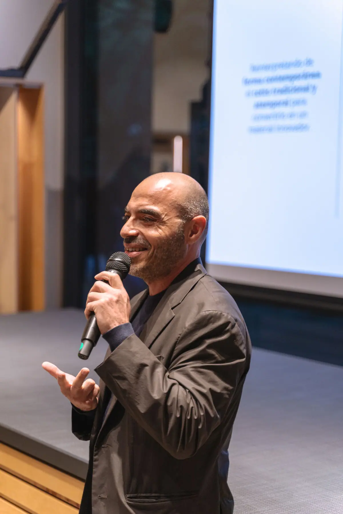 Benedetto Fasciana speaking into a microphone during the talk