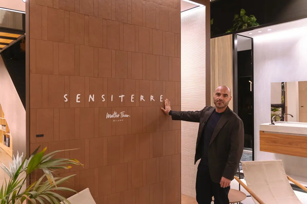 Benedetto Fasciana beside the SensiTerre wall in the Florim space at Matter Barcelona