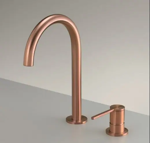 Basin tap with a tall curved spout and a separate mixer in a brushed copper finish