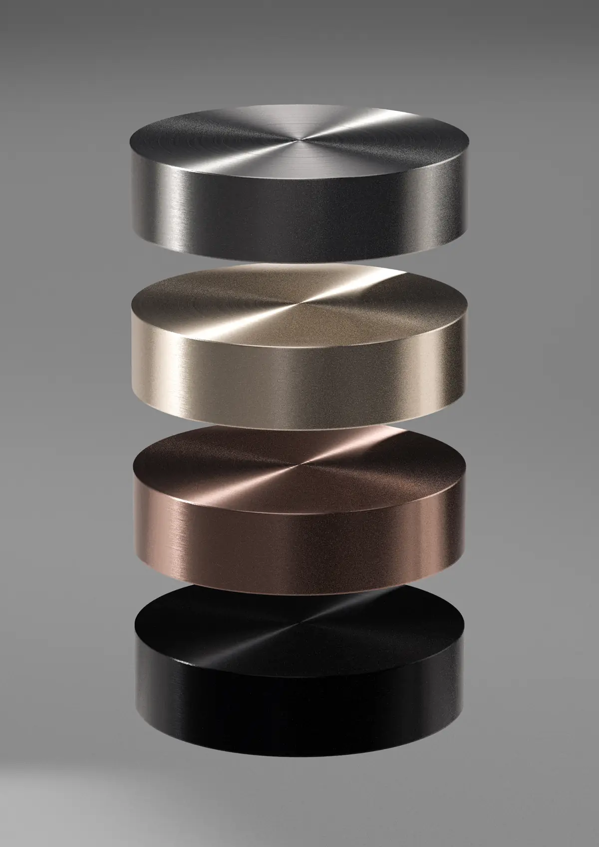 Four stacked metal discs in brushed steel, champagne, bronze and black