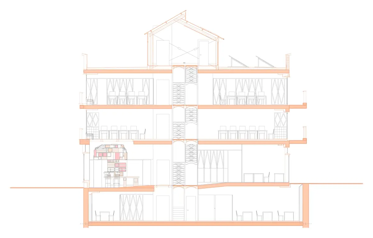 Section through the building with the central staircase rising to the rooftop skylight and the solar panels