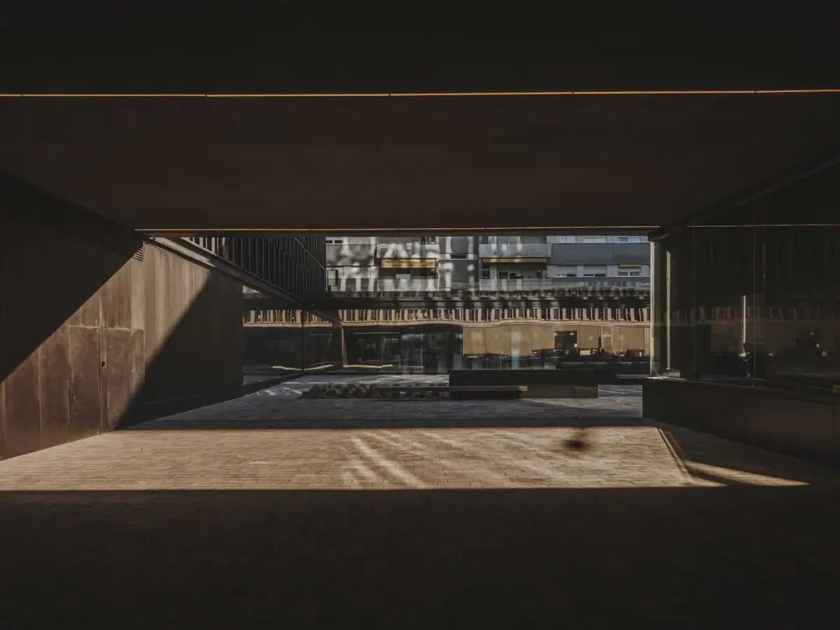Covered passage beneath the building giving public access to the central courtyard