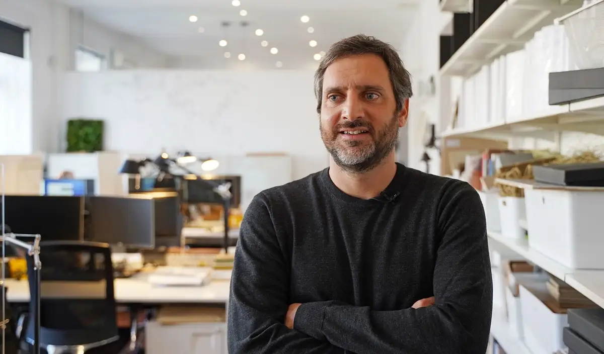 Indalecio Batlles, bearded and in a dark jumper, arms folded in the studio's work area