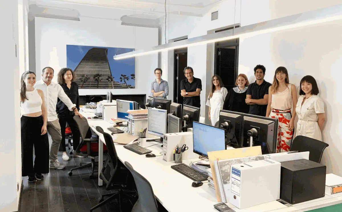 The Ábalos + Sentkiewicz team standing by the studio’s work tables