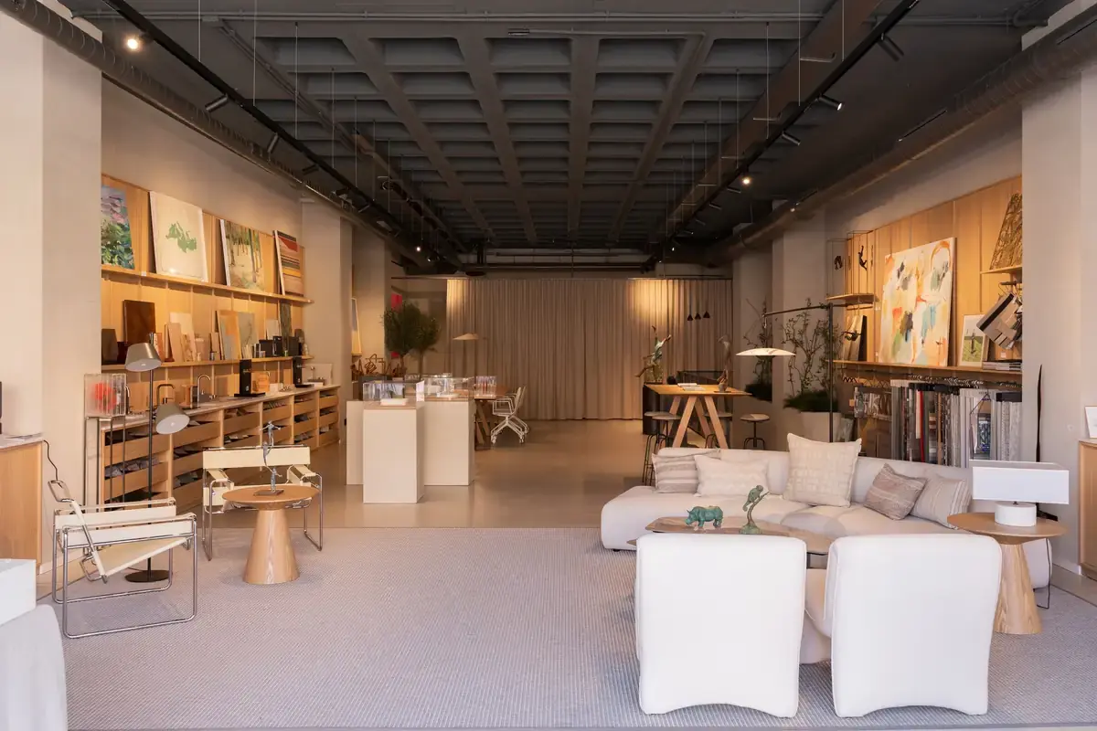 Interior of L35's office in Sotogrande with sample shelves, a lounge area and artworks